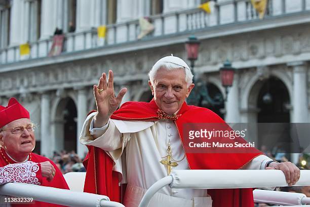 Pope Benedict XVI , accompanied by Angelo Scola, Patriarch of Venice greets the crowd gathered in St Mark's Square while crossing the square on an...