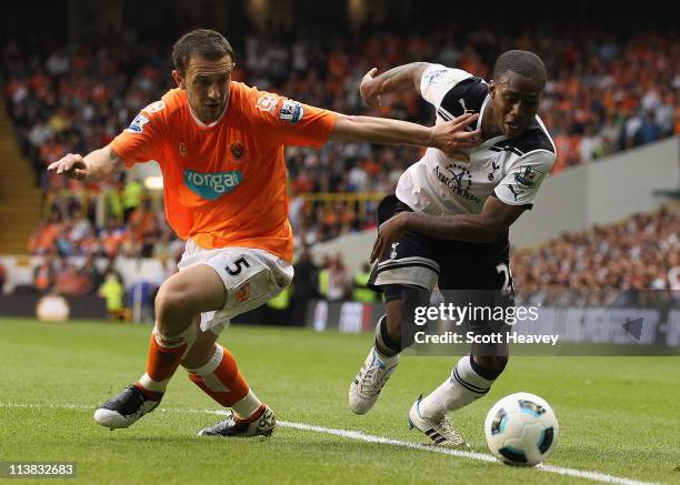 Danny Rose of Spurs is challenged by Neal Eardley of Blackpool during the Barclays Premier League match between Tottenham Hotspur and Blackpool at...