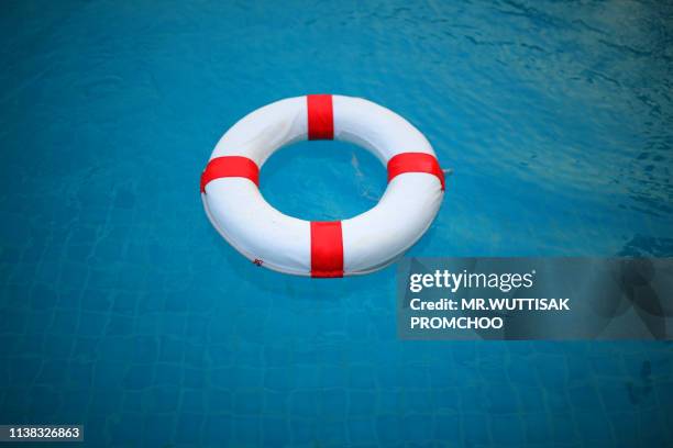 swim ring.red and white lifebuoy. - life ring pool stock pictures, royalty-free photos & images