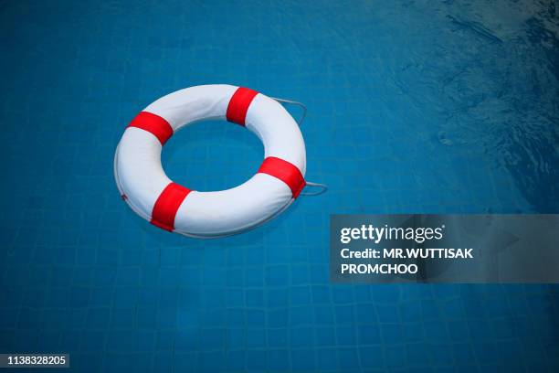 swim ring.red and white lifebuoy. - boia equipamento marítimo de segurança imagens e fotografias de stock