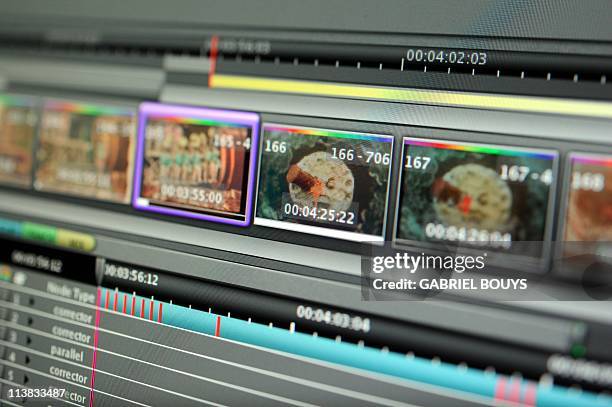 Technician from Technicolor works on April 21, 2011 on the restoration of the 1902 movie "Le voyage dans la lune" by French director Georges Melies....