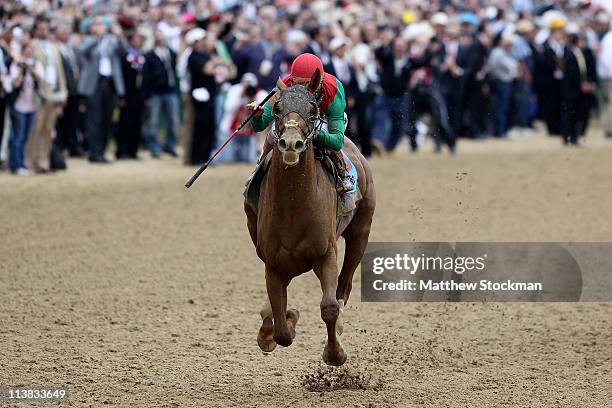 Jockey John Velazquez, riding Animal Kingdom crosses the finish line on way to winning the 137th Kentucky Derby at Churchill Downs on May 7, 2011 in...