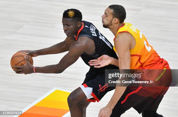 Clint Capela of the Houston Rockets controls the ball in front of Rudy Gobert of the Utah Jazz in the first half of Game Three during the first round...