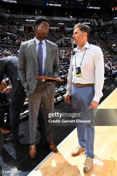 Chris Webber and Brent Barry talk before Game Four of Round One between the Denver Nuggets and the San Antonio Spurs during the 2019 NBA Playoffs on...