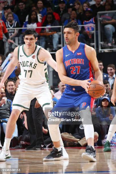 Zaza Pachulia of the Detroit Pistons looks to pass the ball during the game against Ersan Ilyasova of the Milwaukee Bucks during Game Three of Round...