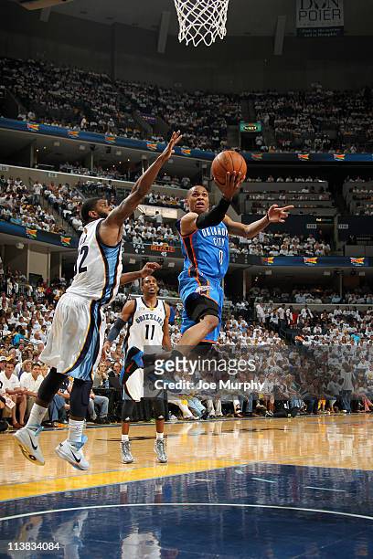 Russell Westbrook of the Oklahoma City Thunder shoots against O.J. Mayo of the Memphis Grizzlies in Game Three of the Western Conference Semifinals...