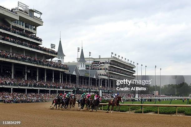 Jockey Jesus L. Castanon , riding Shackleford, leads the field through turn one during the 137th Kentucky Derby at Churchill Downs on May 7, 2011 in...