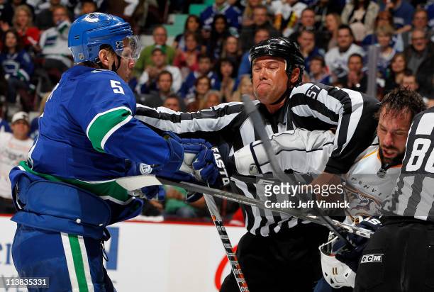 Christian Ehrhoff of the Vancouver Canucks and David Legwand of the Nashville Predators scrap during Game Five of the Western Conference Semifinal of...