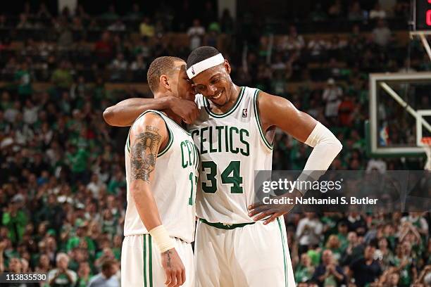 Paul Pierce and Delonte West of the Boston Celtics embrace during a timeout against the Miami Heat during Game Three of the Eastern Conference...