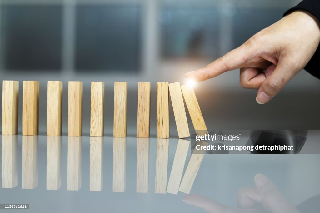Hand stop a dominoes continuous toppled