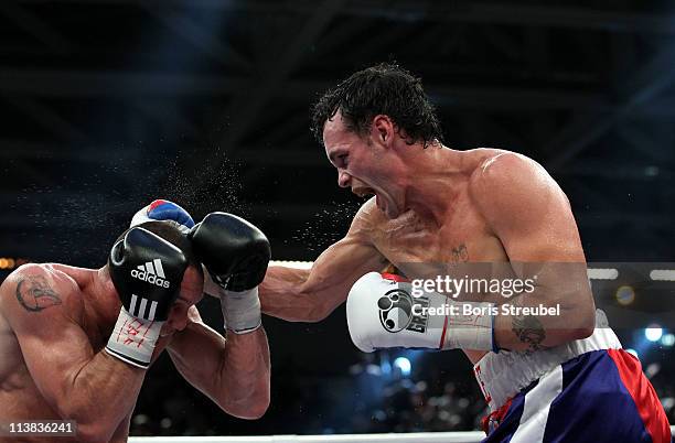 Sebastian Sylvester of Germany and Daniel Geale of Australia exchange punches during their IBF World Championship Middleweight title fight at...