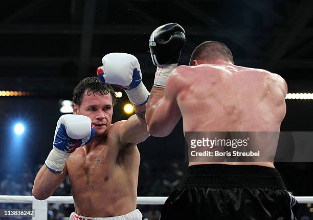 Sebastian Sylvester of Germany and Daniel Geale of Australia exchange punches during their IBF World Championship Middleweight title fight at...