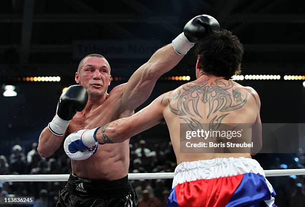 Sebastian Sylvester of Germany and Daniel Geale of Australia exchange punches during their IBF World Championship Middleweight title fight at...