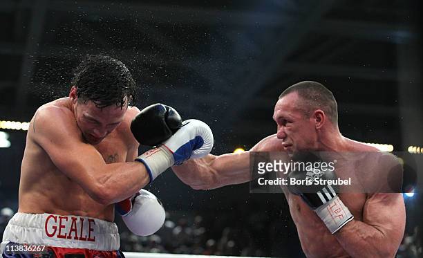 Sebastian Sylvester of Germany and Daniel Geale of Australia exchange punches during their IBF World Championship Middleweight title fight at...