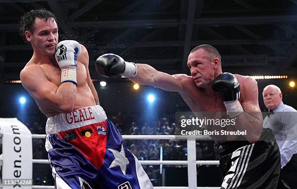 Sebastian Sylvester of Germany and Daniel Geale of Australia exchange punches during their IBF World Championship Middleweight title fight at...