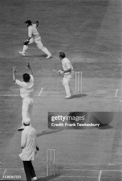 English first-class cricketer John Edrich and Australian cricketer Dennis Lillee in action during the Fourth Test match at The Oval, London, UK, 28th...