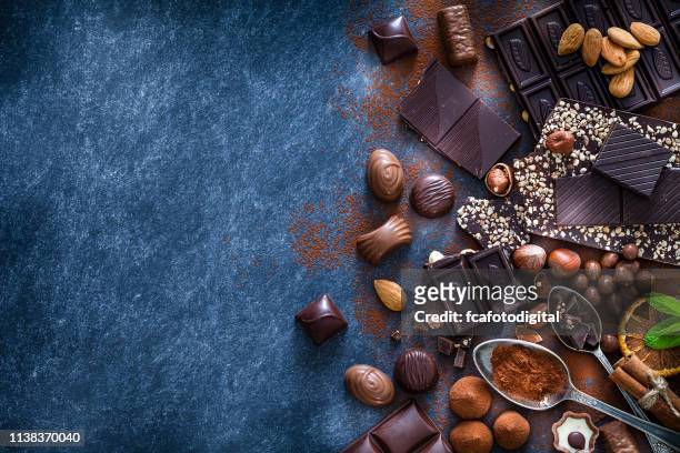 chocolate assortment and cocoa powder with copy space shot from above - chocolate truffles stock pictures, royalty-free photos & images