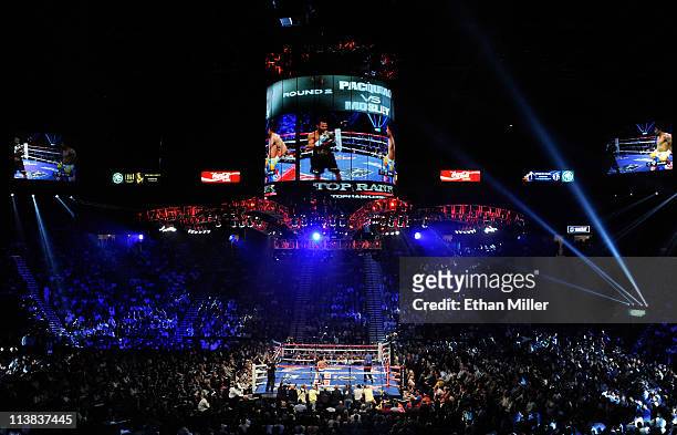 Shane Mosley and Manny Pacquiao of the Philippines in the ring during the second round in the WBO welterweight title fight at MGM Grand Garden Arena...