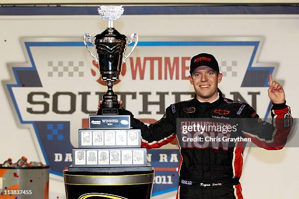 Regan Smith, driver of the Furniture Row Companies Chevrolet, celebrates with in Victory Lane after winning the NASCAR Sprint Cup Series SHOWTIME...