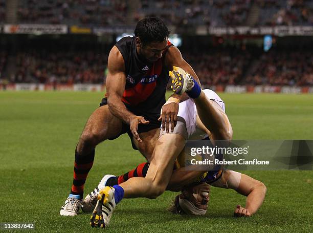 Nathan Lovett-Murray of the Bombers looks to challenge Mark Nicoski of the Eagles during the round seven AFL match between the Essendon Bombers and...