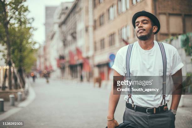 charming black guy in city - suspenders stock pictures, royalty-free photos & images