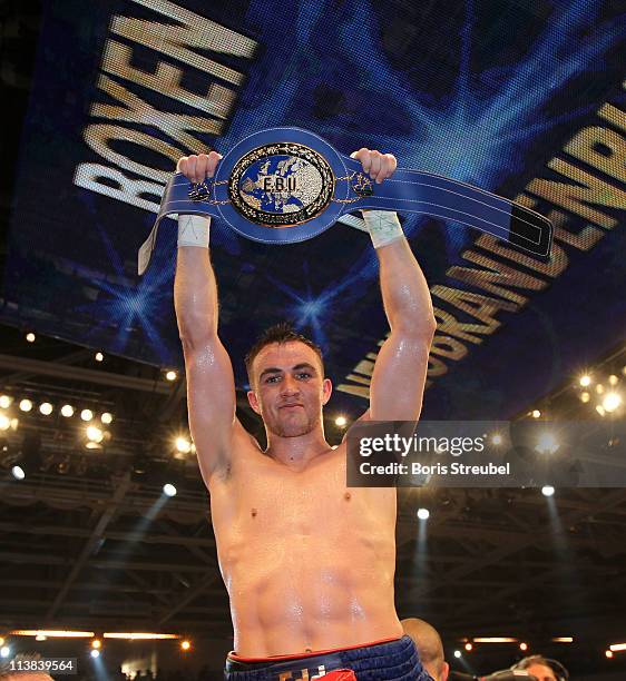 Eduard Gutknecht of Germany celebrates after winning the European Light Heavyweight title fight vs. Danny McIntosh of Great Britain at Jahnsportforum...