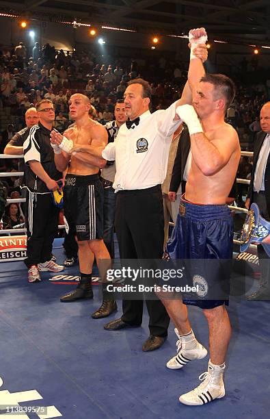 The Ringreferee lift the arm of the new european champion Eduard Gutknecht of Germany after winning his European Light Heavyweight title fight vs....