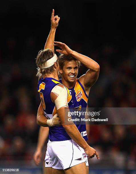 Mark Nicoski of the Eagles celebrates a goal with Mark LeCras during the round seven AFL match between the Essendon Bombers and the West Coast Eagles...