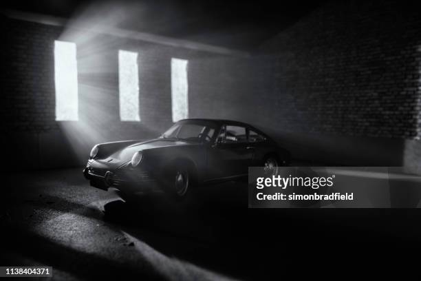 model porsche 911 in atmospheric garage - porsche 911 stock pictures, royalty-free photos & images