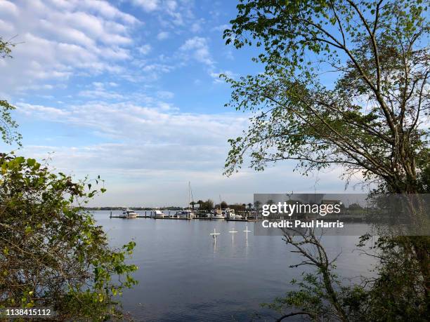 View from Shell Beach drive shows 3 white crosses in the lake and Veterans Memorial Park March 19, 2019 Lake Charles , Louisiana