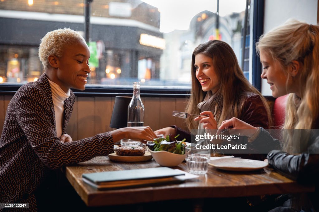 Londoners women eating together at a restaurant