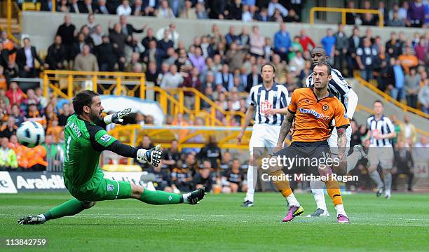 Steven Fletcher of Wolves shoots past Scott Carson of West Brom and scores to make it 3-0 during the Barclays Premier League match between...