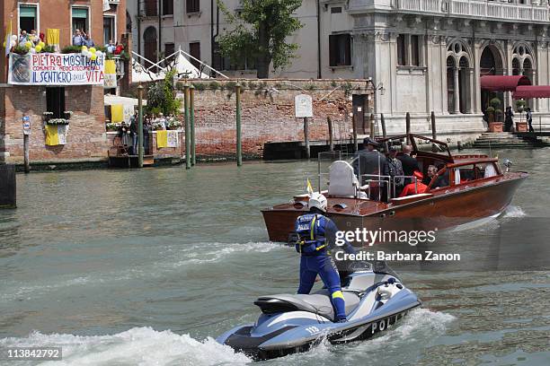 Pope Benedict XVI acknowledges well-wishers around the Gran Canal on May 8, 2011 in Venice, Italy. Pope Benedict XVI is visiting Venice, some 26...