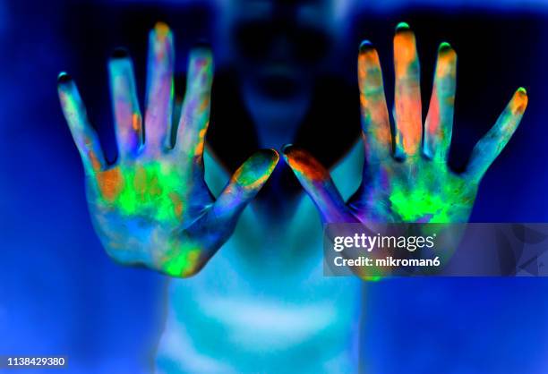 hands showing powder paint during party - uv light stock pictures, royalty-free photos & images