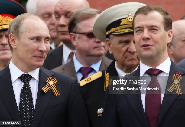 Russian Prime Minister Vladimir Putin and President Dmitry Medvedev attend a wreath laying ceremony near the Tomb of Unknown Soldier on May 8, 2011...