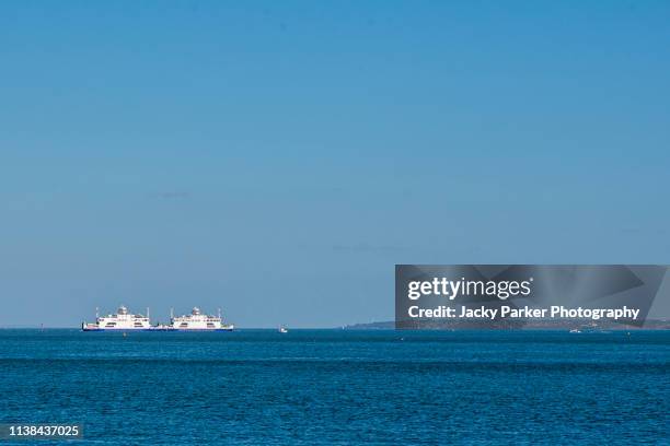 the beautiful coastal marshes and lagoons of the lymington and keyhaven nature reserve on the edge of the solent overlooking the isle of wight - isle of wight ferry stock pictures, royalty-free photos & images