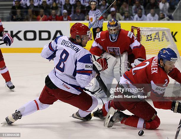 Zbynek Michalek of Czech Republic and Alexander Ovechkin of Russia battle for the puck during the IIHF World Championship qualification match between...