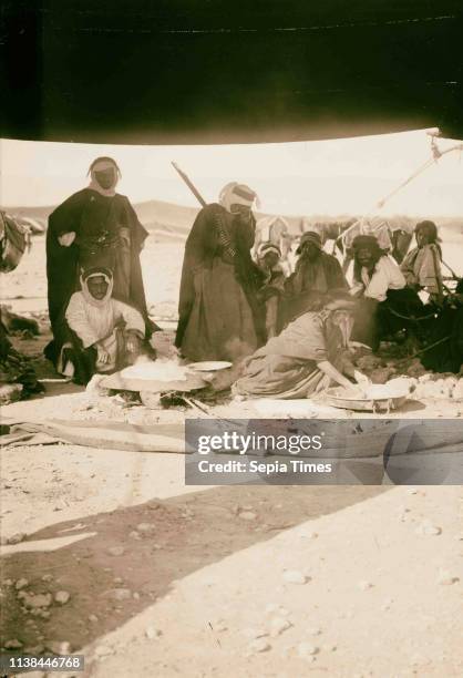 Bedouin making bread 1900, The Bedouin are nomadic Arab peoples who inhabited the desert regions in North Africa, the Arabian Peninsula, Iraq and the...