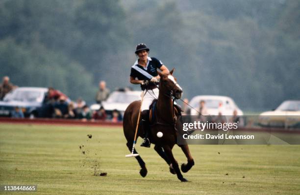 Prince Charles plays in the Queen"u2019s Cup at Guards Polo Club in Windsor, Berkshire, on May 29, 1983.