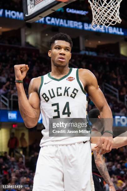 Giannis Antetokounmpo of the Milwaukee Bucks reacts after scoring during the second half against the Cleveland Cavaliers at Quicken Loans Arena on...