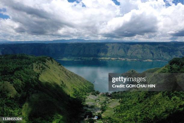 This aerial picture taken of April 4 2019 shows Indonesia's Lake Toba, from Sigapitan, which covers some 1,707 square kilometers of North Sumatera,...