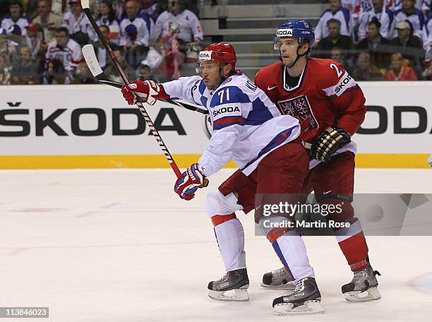 Zbynek Michalek of Czech Republic skates against Ilya Kovalchuk of Russia during the IIHF World Championship qualification match between Czech...