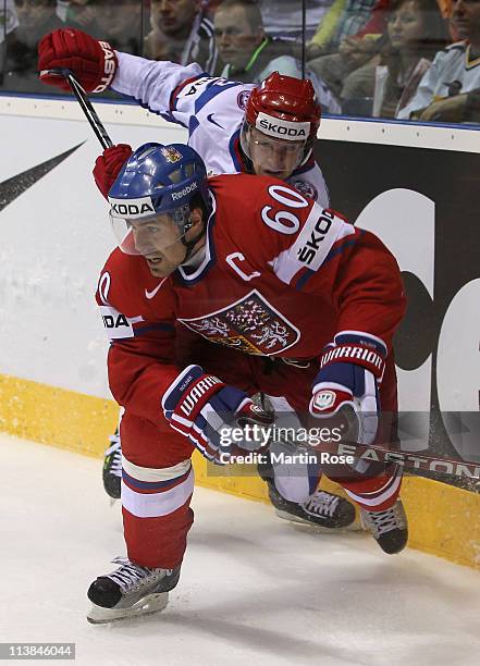 Tomas Rolinek of Czech Republic skates against Alexei Tereshenko of Russia during the IIHF World Championship qualification match between Czech...