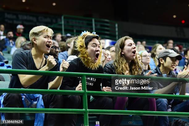 Fans cheer during the bout between Andrea Vittoria Rizzi of St. John's and Anne Cebula of Columbia during the Division I Women's Fencing Championship...