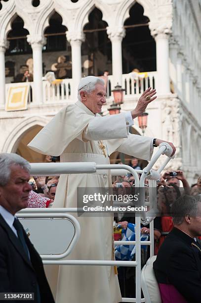 Pope Benedict XVI leaves St. Mark's Square on board an electric car on May 8, 2011 in Venice, Italy. Pope Benedict XVI is visiting Venice, some 26...