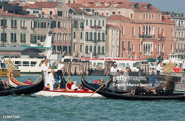 Pope Benedict XVI sits aboard the Dogaressa gondola, which is escorted by several gondolas, at St. Mark's basin on May 8, 2011 in Venice, Italy. Pope...