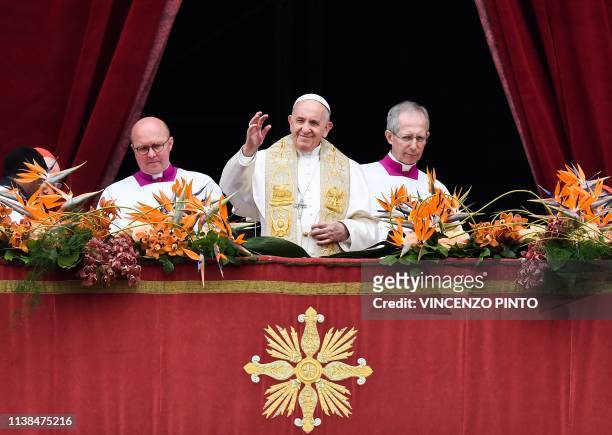 Pope Francis delivers the "Urbi et Orbi" blessing to the city and to the world from the balcony of St Peter's basilica, on April 21, 2019 after the...