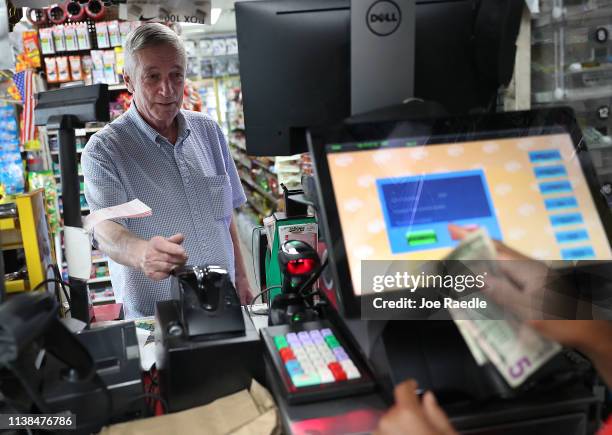 David Knight buys Powerball tickets at the Shell Gateway store on March 26, 2019 in Boynton Beach, Florida. Wednesday's Powerball drawing will be an...