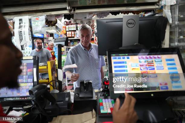 David Knight buys Powerball tickets at the Shell Gateway store on March 26, 2019 in Boynton Beach, Florida. Wednesday's Powerball drawing will be an...