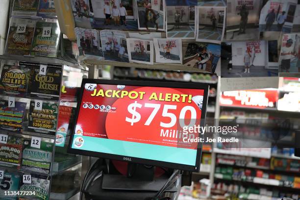 The Powerball jackpot is seen on a sign at the Shell Gateway store on March 26, 2019 in Boynton Beach, Florida. Wednesday's Powerball drawing will be...